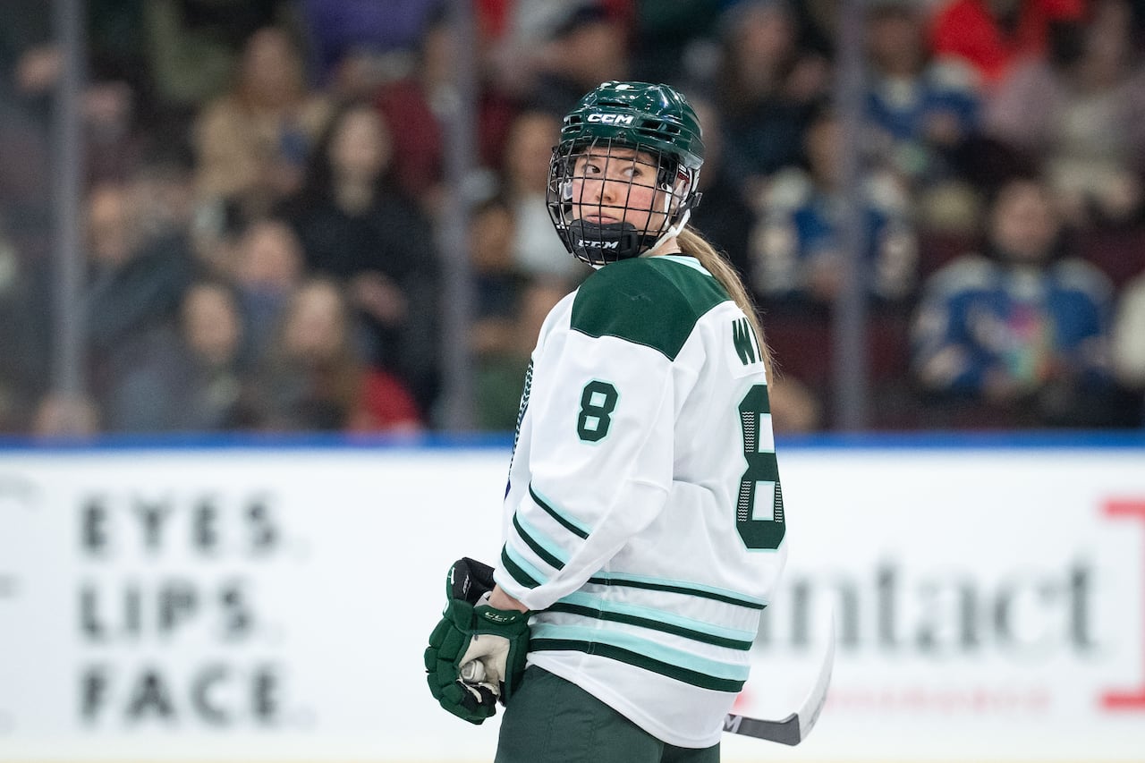 Image 6: A hockey player surveys the ice.