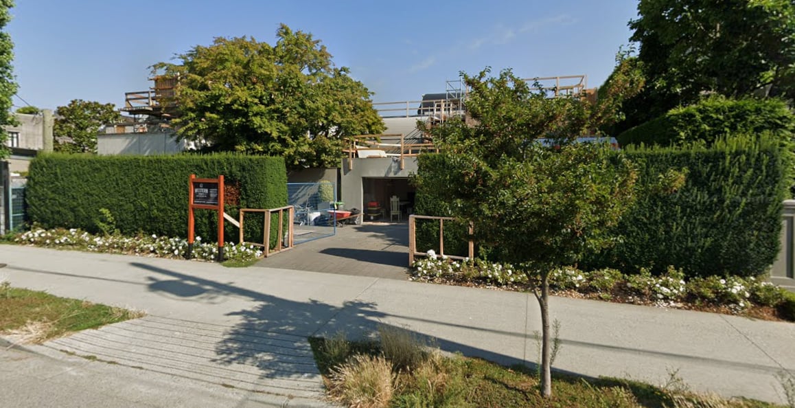 Image 4: A property under renovation with large hedges and trees visible.