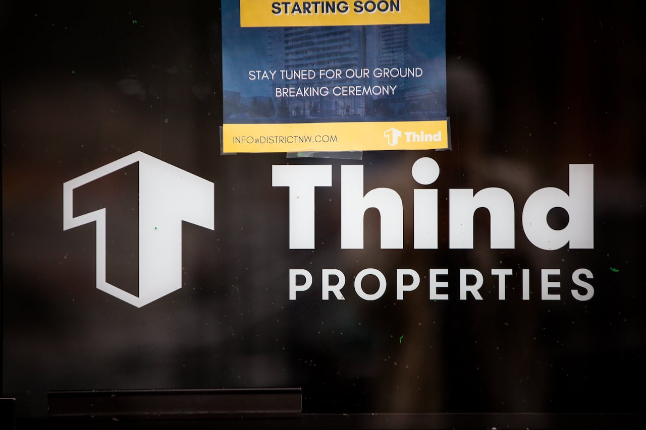 Image 5: A sign that says Thind Properties.
