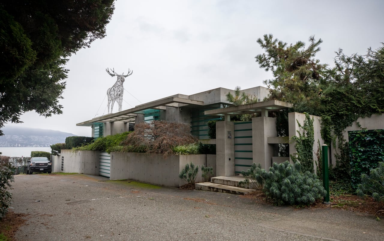 Image 4: A large house on a cloudy day.