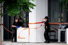 Image 3: Police forensic teams work the scene of a shooting the day before, in Montreal on Tuesday, June 23, 2026. THE CANADIAN PRESS/Christopher Katsarov